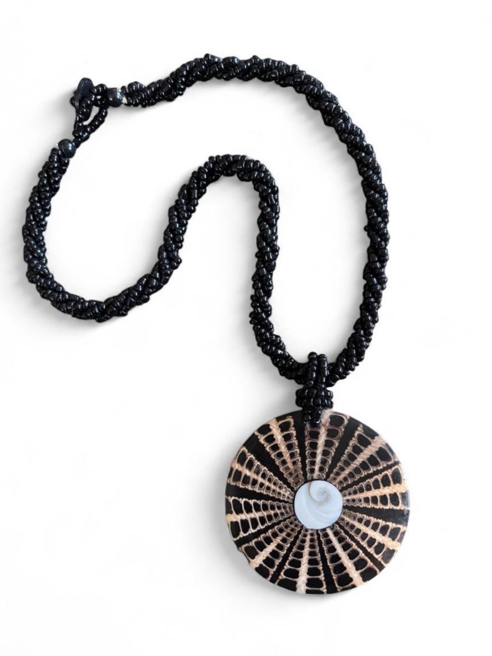 Vintage black & white beaded necklace with circular shell pendant